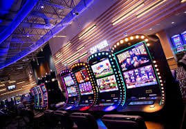 Colorful online slot machine interface with spinning reels on mobile